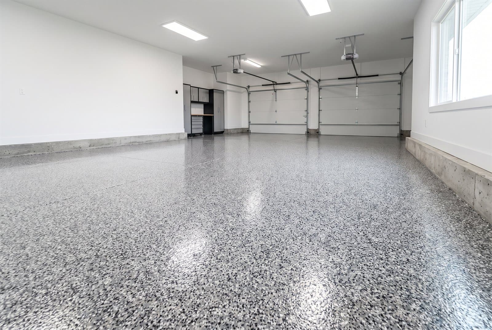 Grey, white and black flake and chip epoxy garage floor