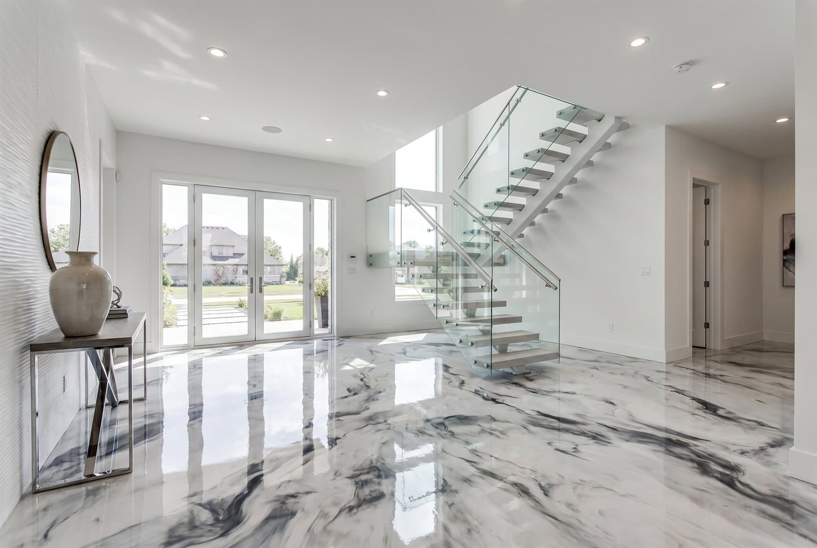 White and grey marble-look epoxy floor in a home entryway