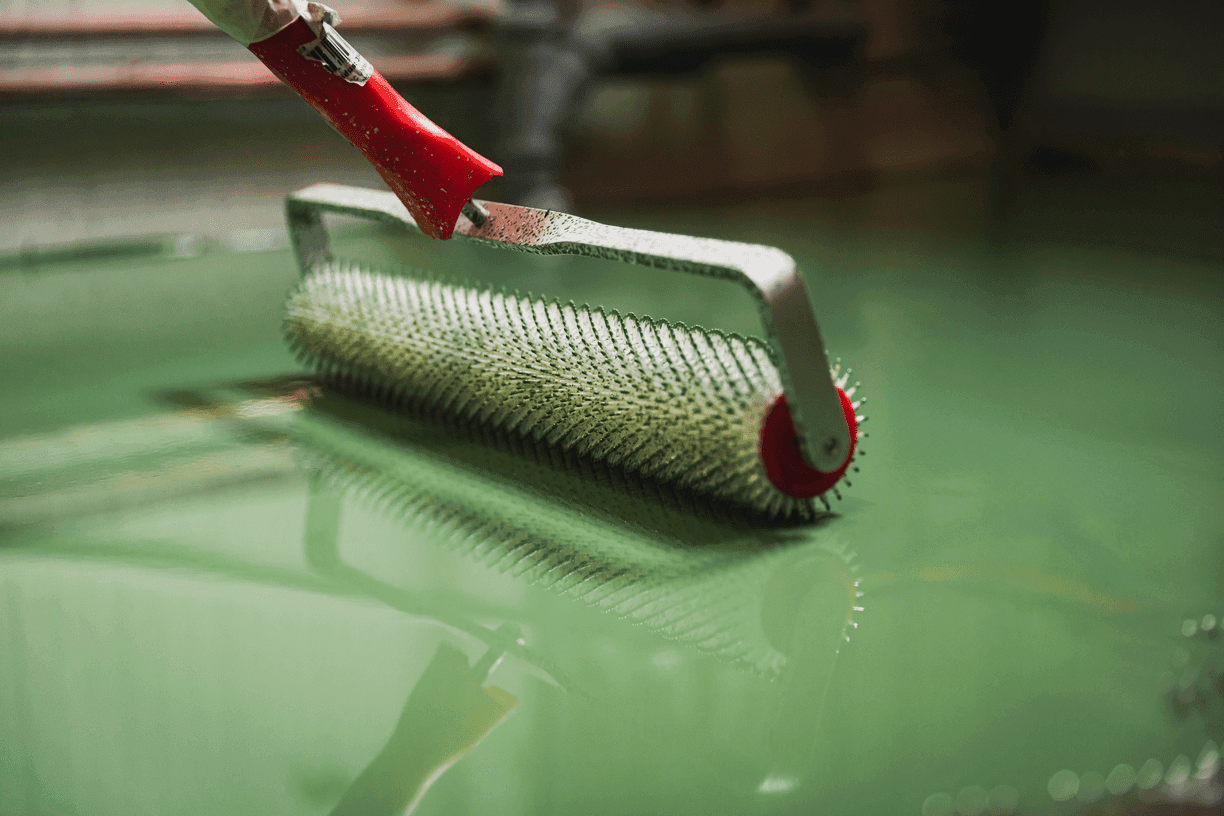 Iowa suburban home with open garage showing a glossy epoxy floor